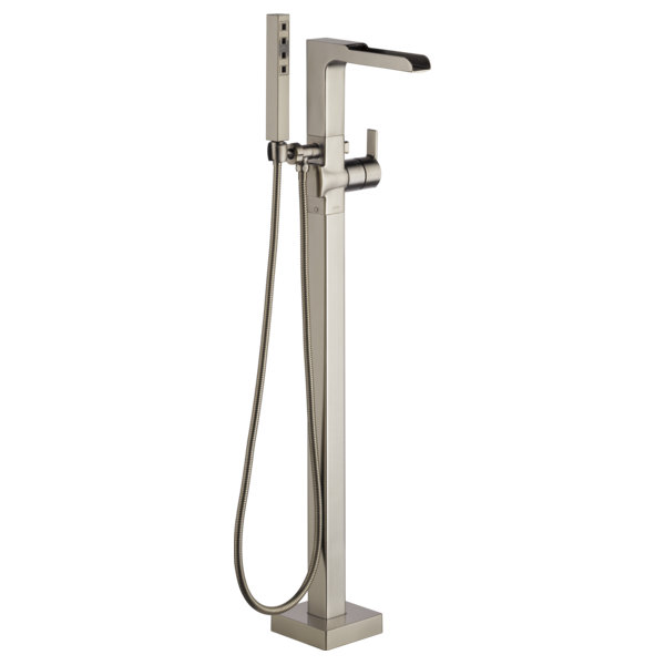 Brushed nickel floor-mounted tub filler with single handle, channel spout, and detachable hand shower on cord.