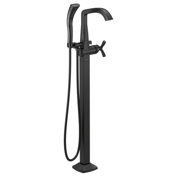 Matte black floor-mount tub filler with curved spout, cross handles, and detachable handheld shower head.