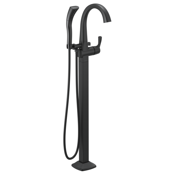 Black arc floor mount tub filler with single lever handle and handheld showerhead on hose.