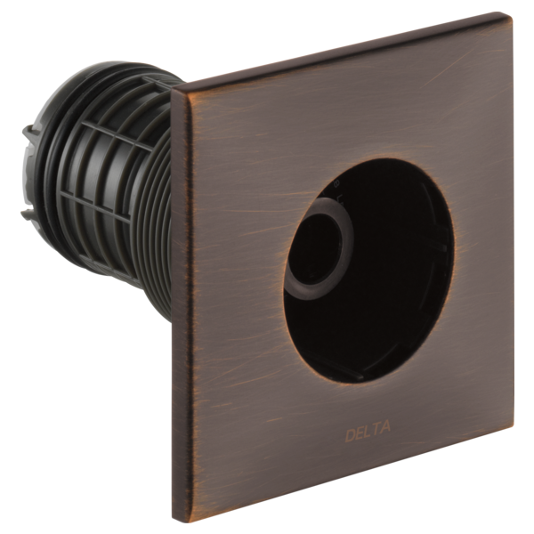 Square bronze trim plate with circular outlet and ribbed body spray nozzle visible inside.