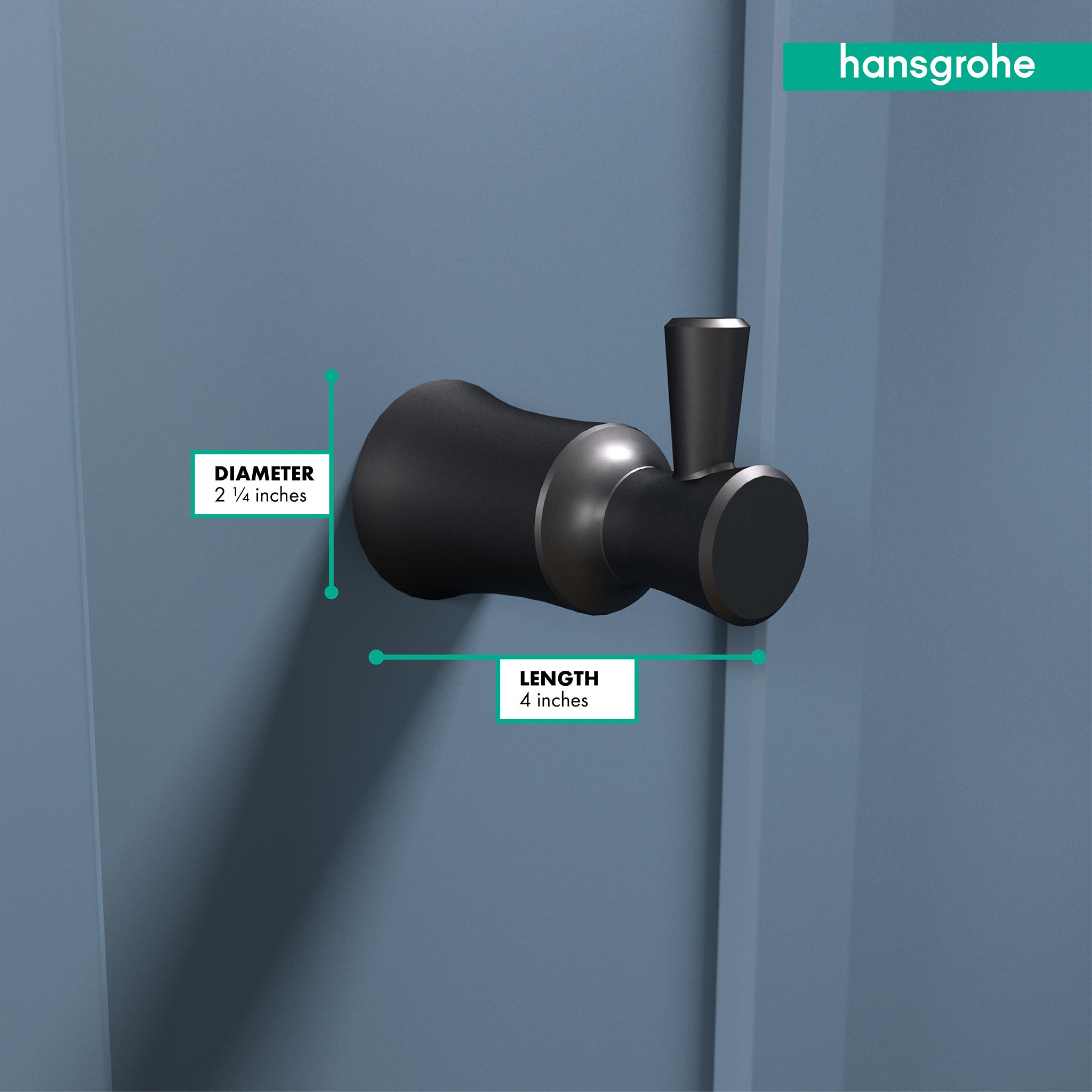 Matte black Joleena hook with cylindrical design mounted on wall, showing 2 1/4 inch diameter and 4 inch length.