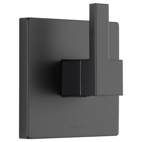 Matte black square diverter trim with lever handle mounted on gray rectangular escutcheon plate.