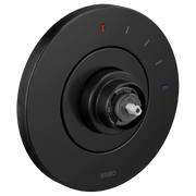 Matte black circular valve trim with concentric rings, temperature indicator markings, and central dial mechanism.