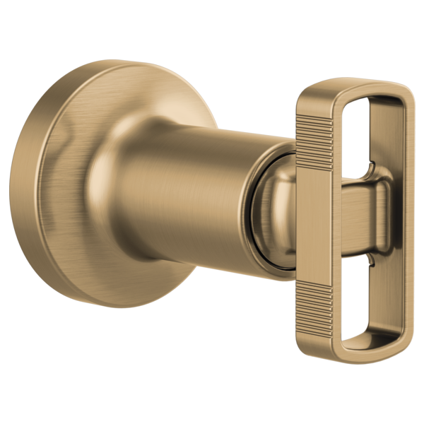 Brushed gold volume control trim with cylindrical spout and rectangular knob handle.