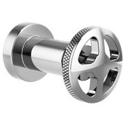Chrome wheel-style volume control trim with textured grip ring and cylindrical valve body connection.