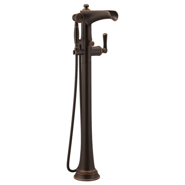 Bronze freestanding floor-mount tub filler with curved spout, side controls, and attached handheld showerhead.