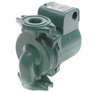 Green cast iron wood boiler pump with motor housing, inlet port on top, and curved impeller chamber visible from the side.