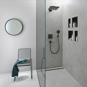 Matte black wall-mounted rectangular niche with open frame installed in bathroom shower wall above toiletries.