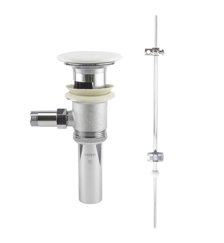 Cotton white Toto drain assembly with pop-up stopper and vertical kick lever control rod with decorative cover plate.