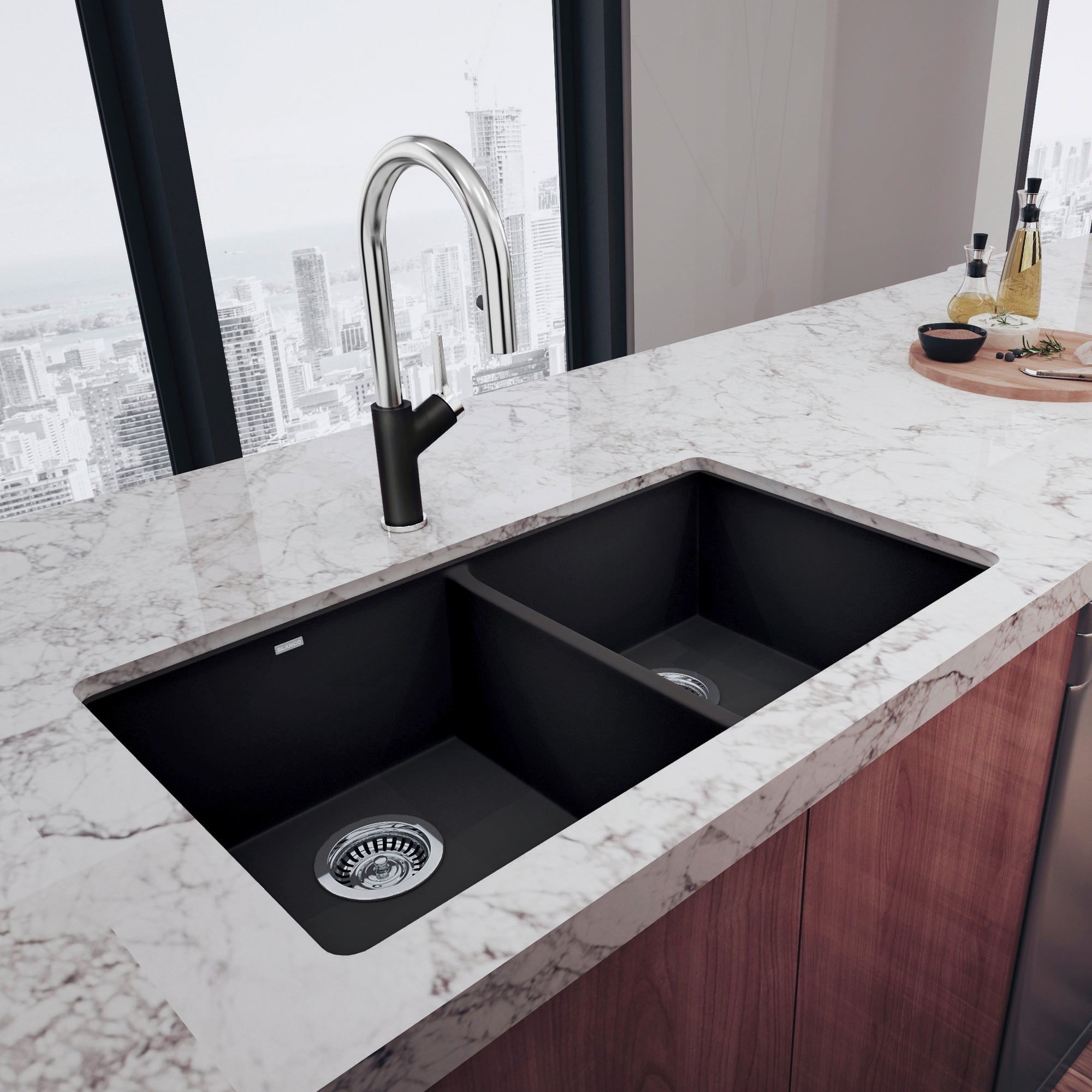 Anthracite undermount double bowl sink with two equal rectangular basins installed in marble countertop.