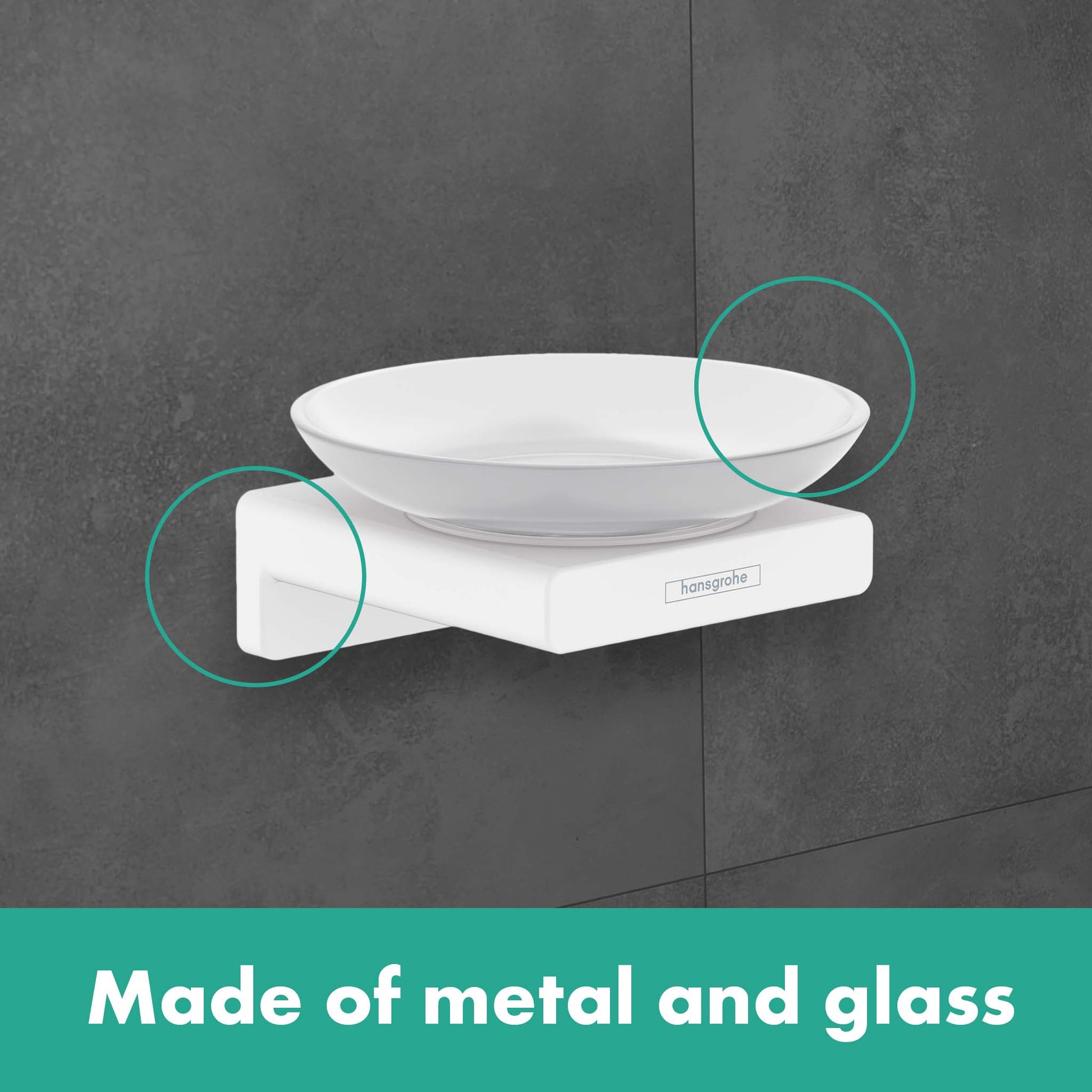 White metal soap dish with glass bowl mounted on gray tile wall.