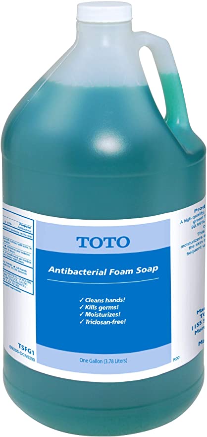 Toto antibacterial foam soap in a clear gallon jug with turquoise liquid and white cap.
