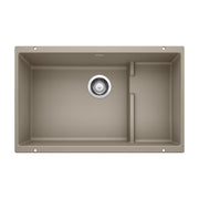 Truffle undermount kitchen sink with single large basin, smaller right compartment, and chrome drain strainer.