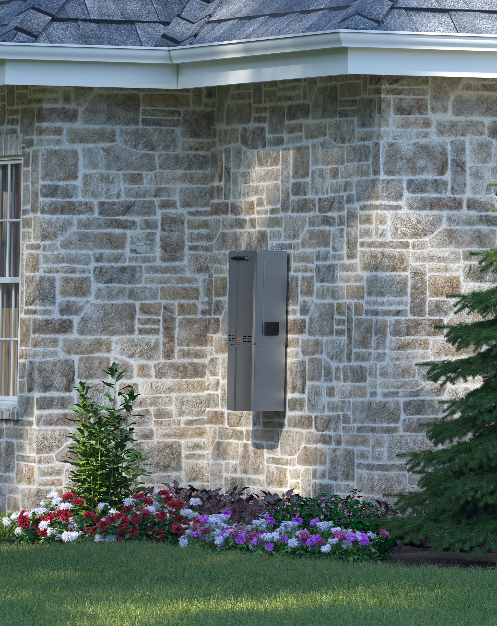 Gray tankless water heater mounted on stone exterior wall with flowers and landscaping below.