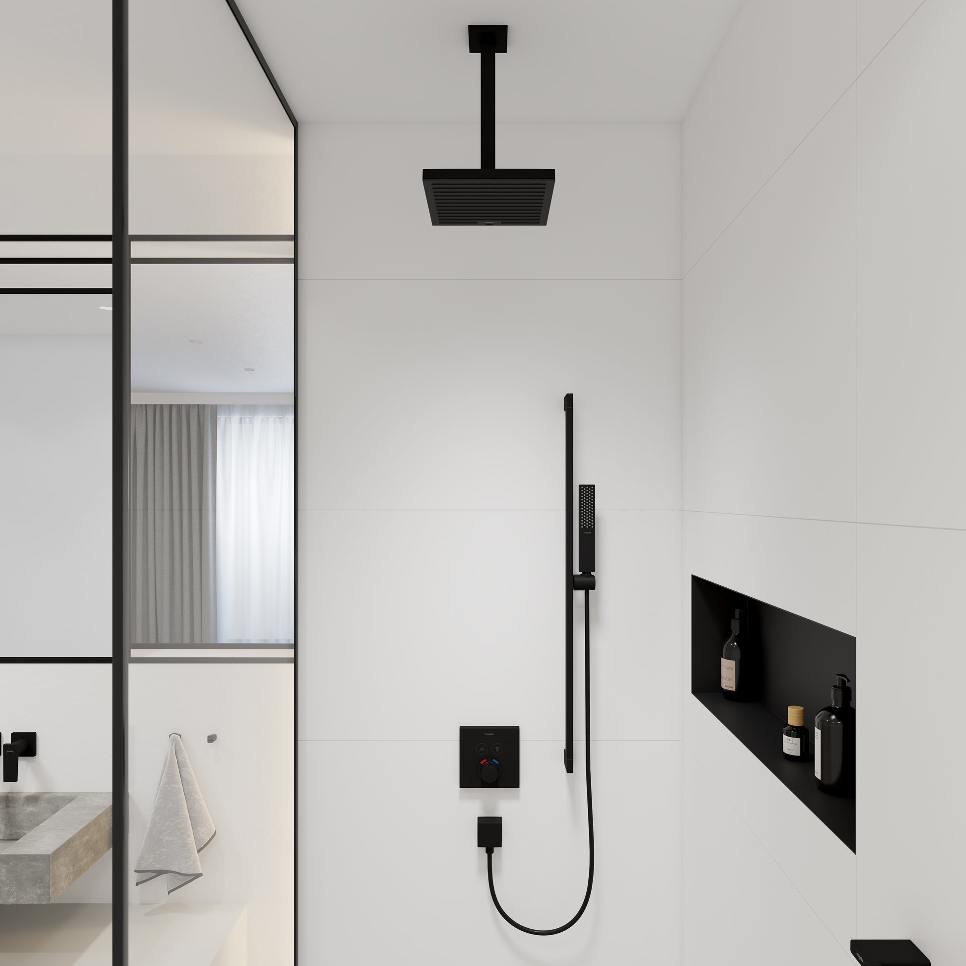 Matte black ceiling-mounted shower extension pipe with square showerhead, installed above wall-mounted control panel in bathr