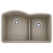 Truffle-colored undermount kitchen sink with two unequal basins, low divider, and chrome drain fittings.