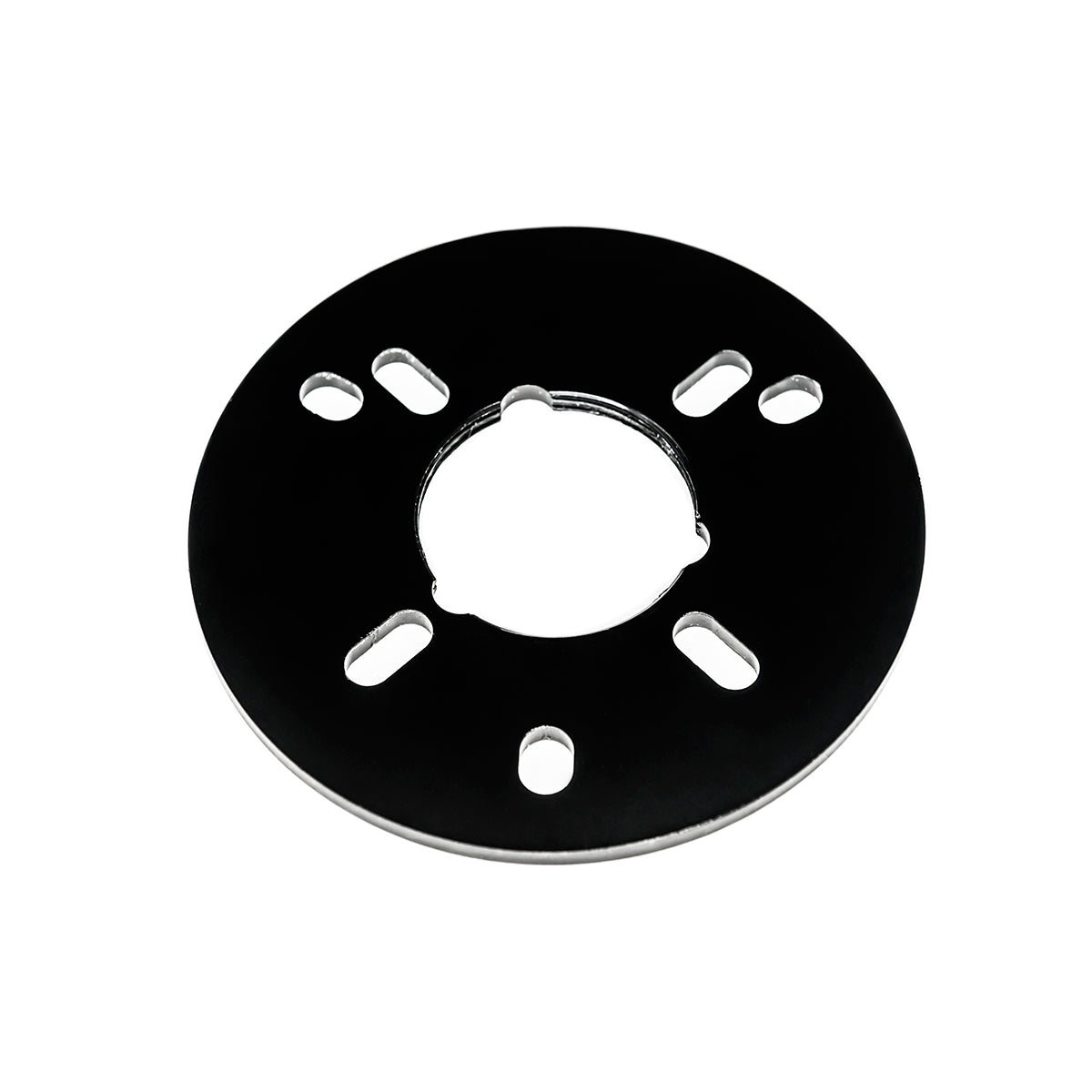 Black circular drain component with central opening and eight mounting slots arranged around the perimeter.