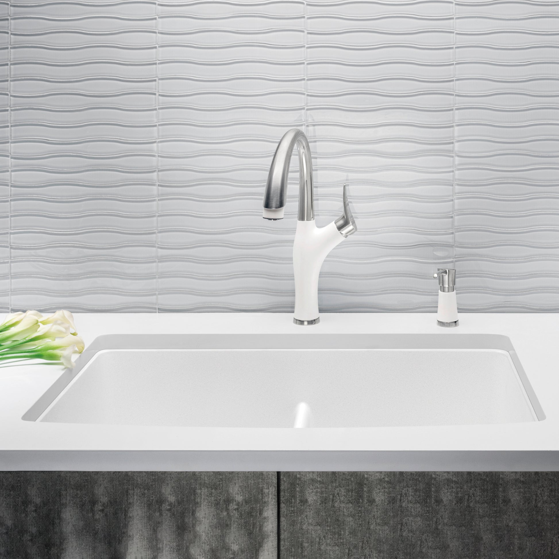 White undermount kitchen sink with equal double bowls and low divider, paired with chrome pull-down faucet and soap dispenser