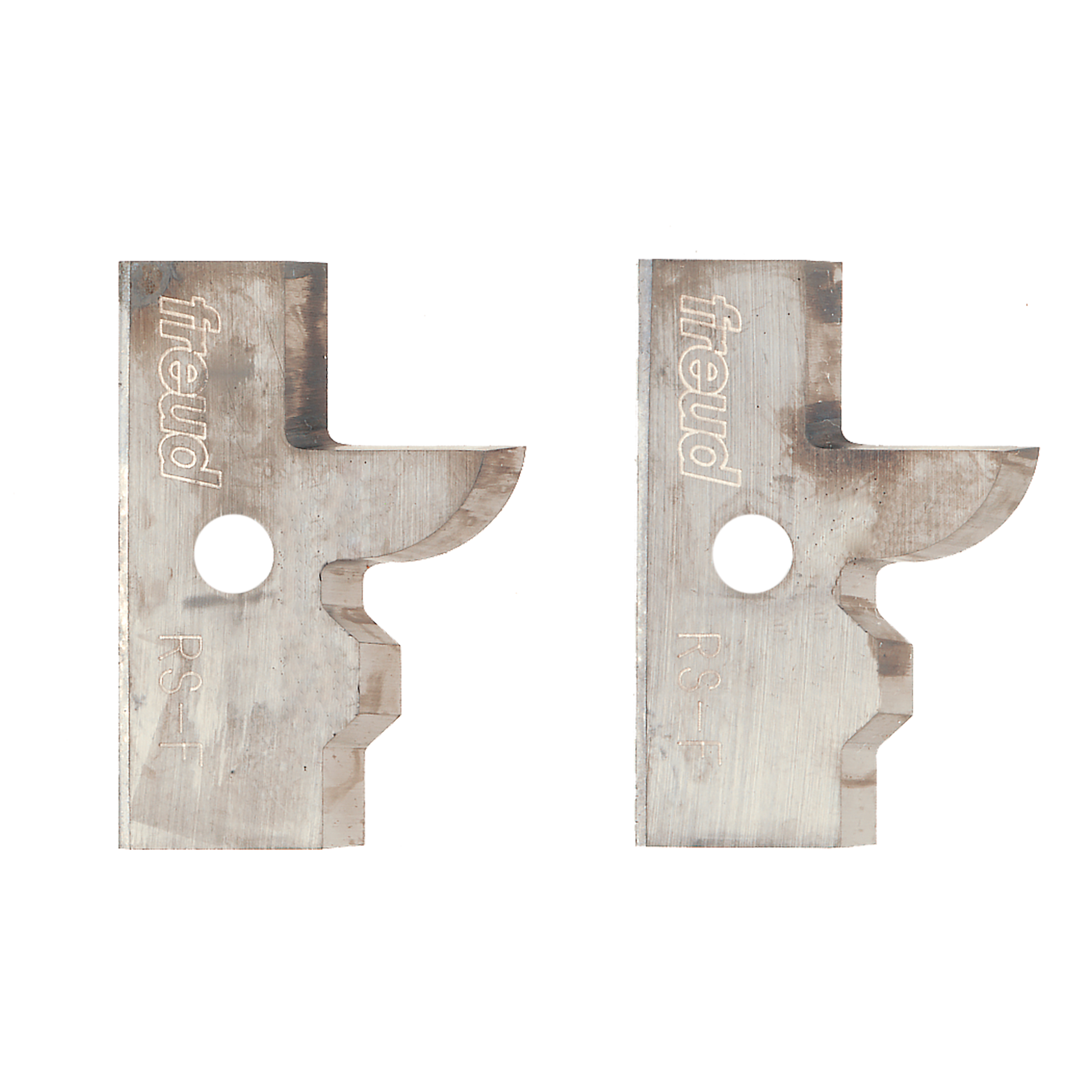 Two metal profile knife blades with curved edges and center holes, stamped with Freud branding.