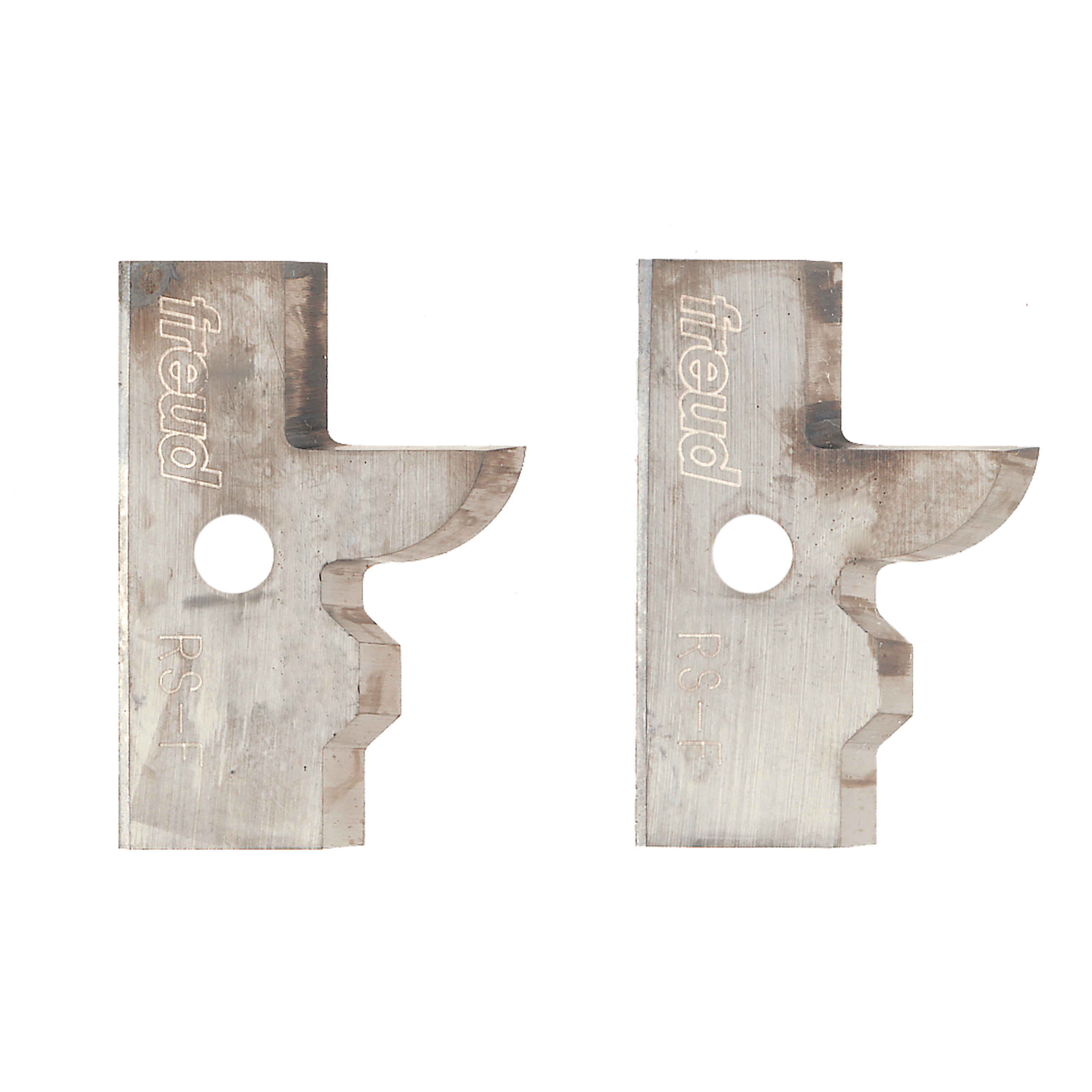 Two metal profile knife blades with curved edges and center holes, stamped with Freud branding.