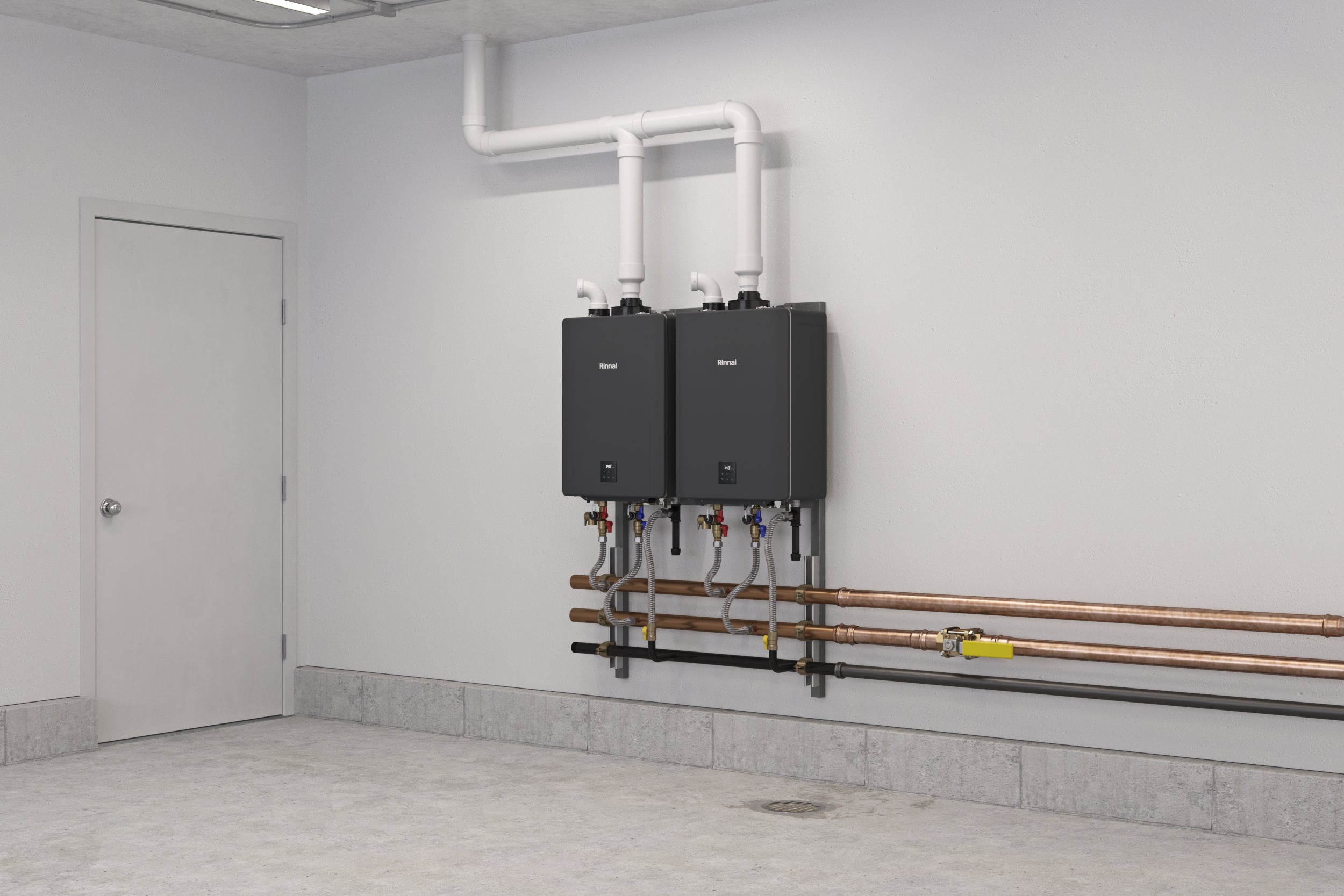 Two black Rinnai tankless water heaters mounted on wall with white PVC piping and copper tubing connections in utility room.