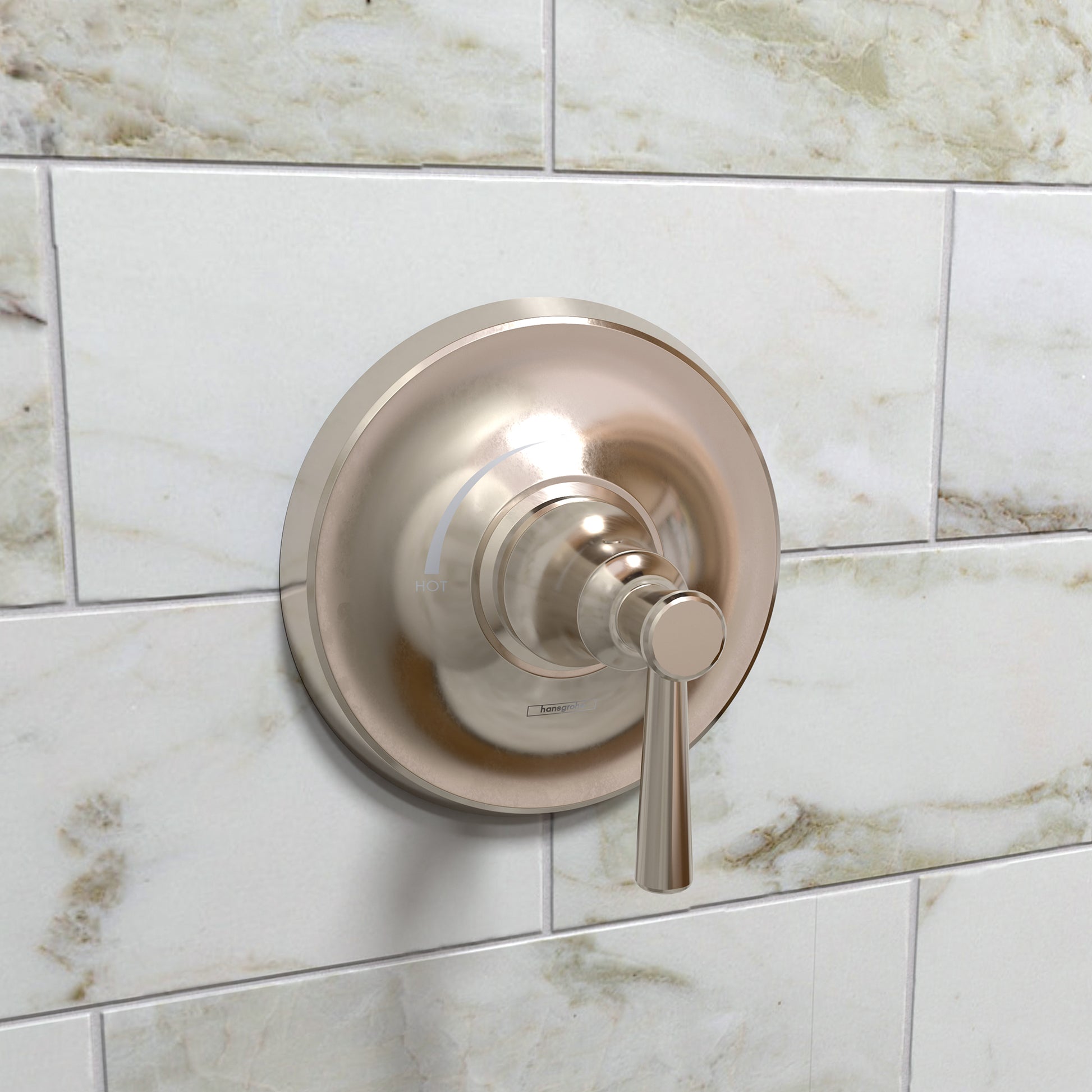 Polished nickel pressure balance shower trim with circular escutcheon and lever handle mounted on marble tile wall.
