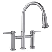 Stainless steel bridge kitchen faucet with arched pulldown spout and dual lever handles.
