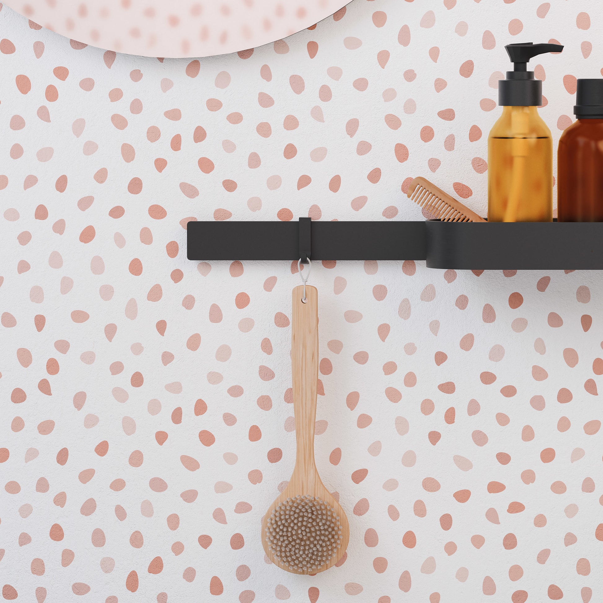 Matte black rectangular towel hook mounted on wall with wooden brush and bath products displayed.