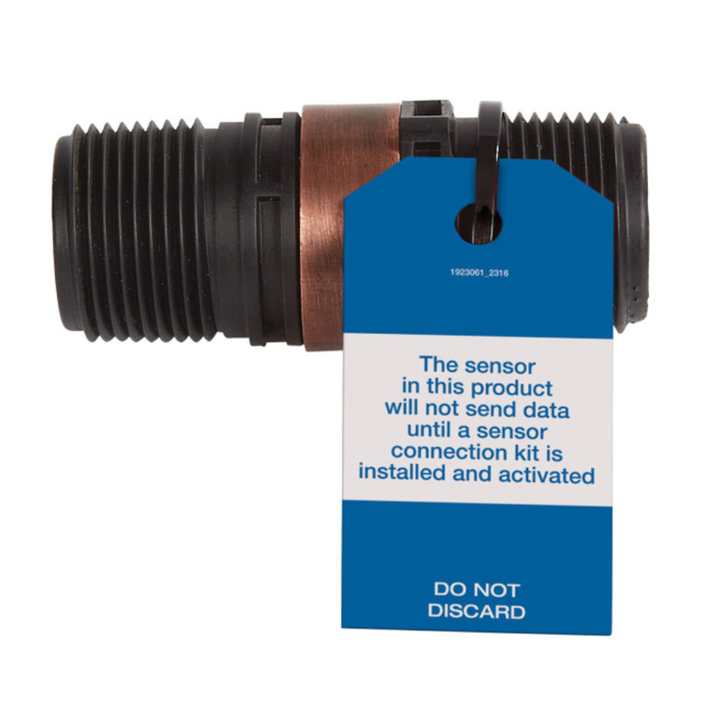 Iron boiler pressure relief valve with threaded outlets, copper band, and blue sensor tag attached.