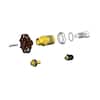 Woodford repair kit components laid out including valve seat, spring, washer, and other brass and metal parts.