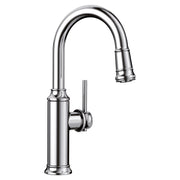 Chrome pull-down kitchen faucet with curved spout, single lever handle, and retractable spray head.