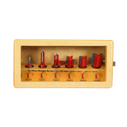 Six router bits with red and gray cutting edges in tan storage case with labeled compartments.