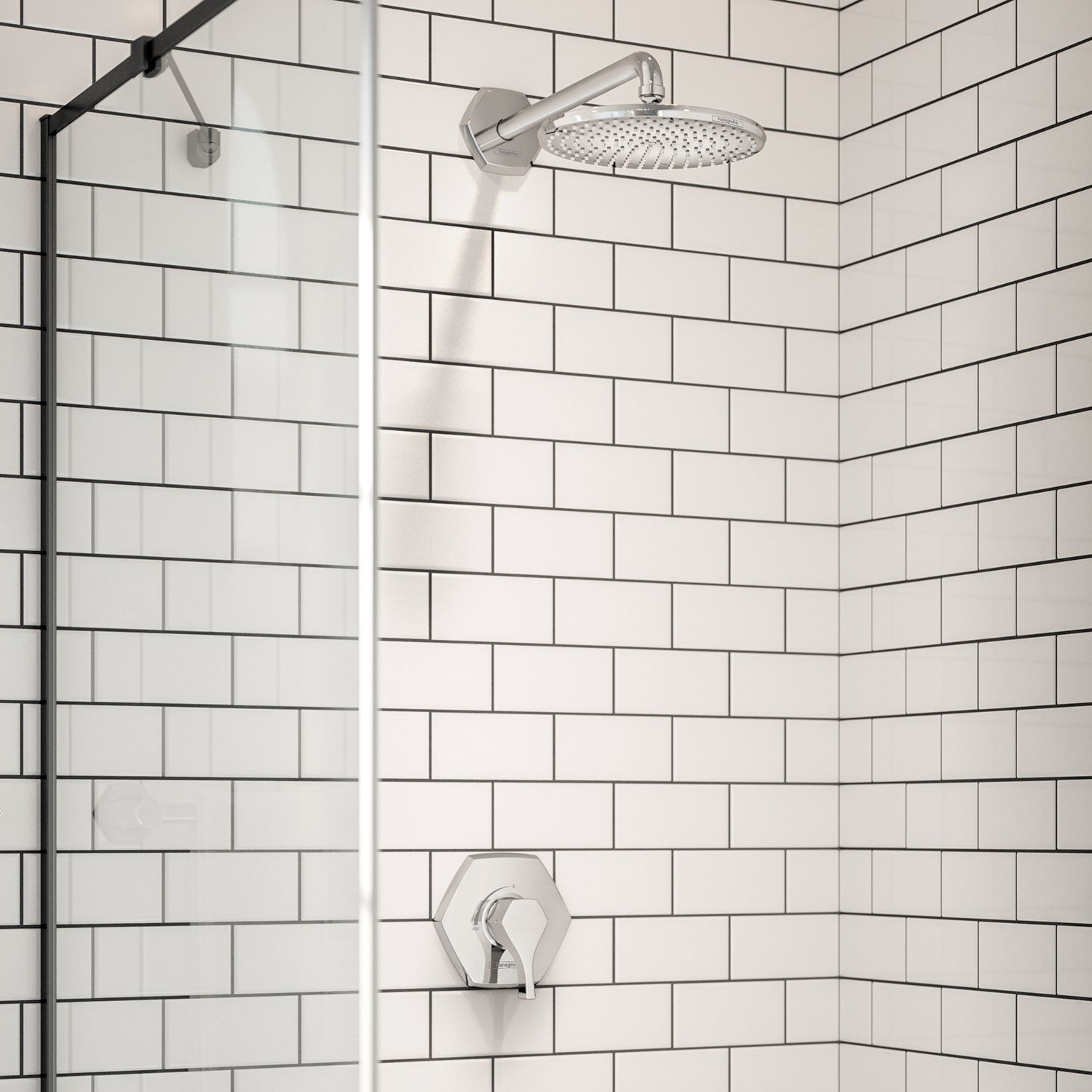 Chrome shower trim with round overhead showerhead and wall-mounted pressure balance valve on subway tile shower wall.