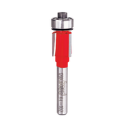 Freud bearing flush trim bit with red plastic body and stainless steel top bearing, mounted on metal shaft.