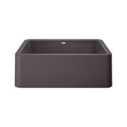 Cinder-colored single bowl farmhouse sink with apron front and rounded corners, viewed from above at an angle.