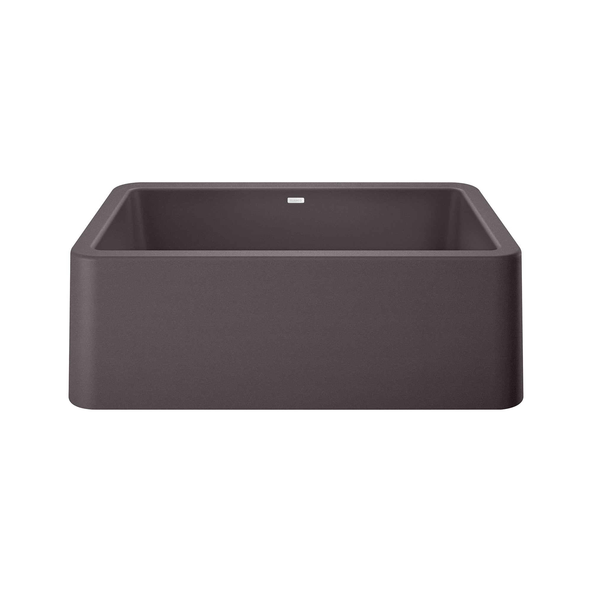 Cinder-colored single bowl farmhouse sink with apron front and rounded corners, viewed from above at an angle.