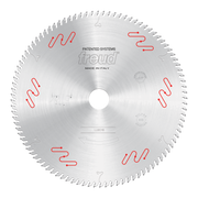 Circular saw blade with carbide-tipped teeth, central arbor hole, and red patented system markings on silver metal surface.