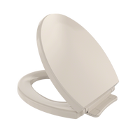 Bone-colored round toilet seat and lid shown open, with slow-close mechanism hinges visible on the base.