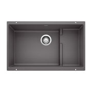 Cinder gray undermount kitchen sink with single large basin, smaller side compartment, and chrome drain strainer.