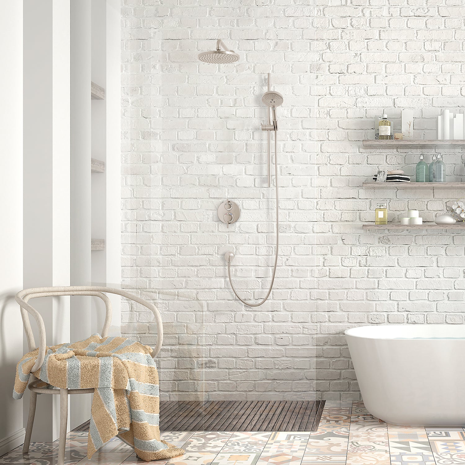 Brushed nickel thermostatic shower system with overhead and hand-held showerheads mounted on white brick bathroom wall.