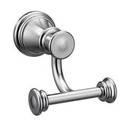 Chrome double robe hook with round backplate and cylindrical knobs mounted on wall.