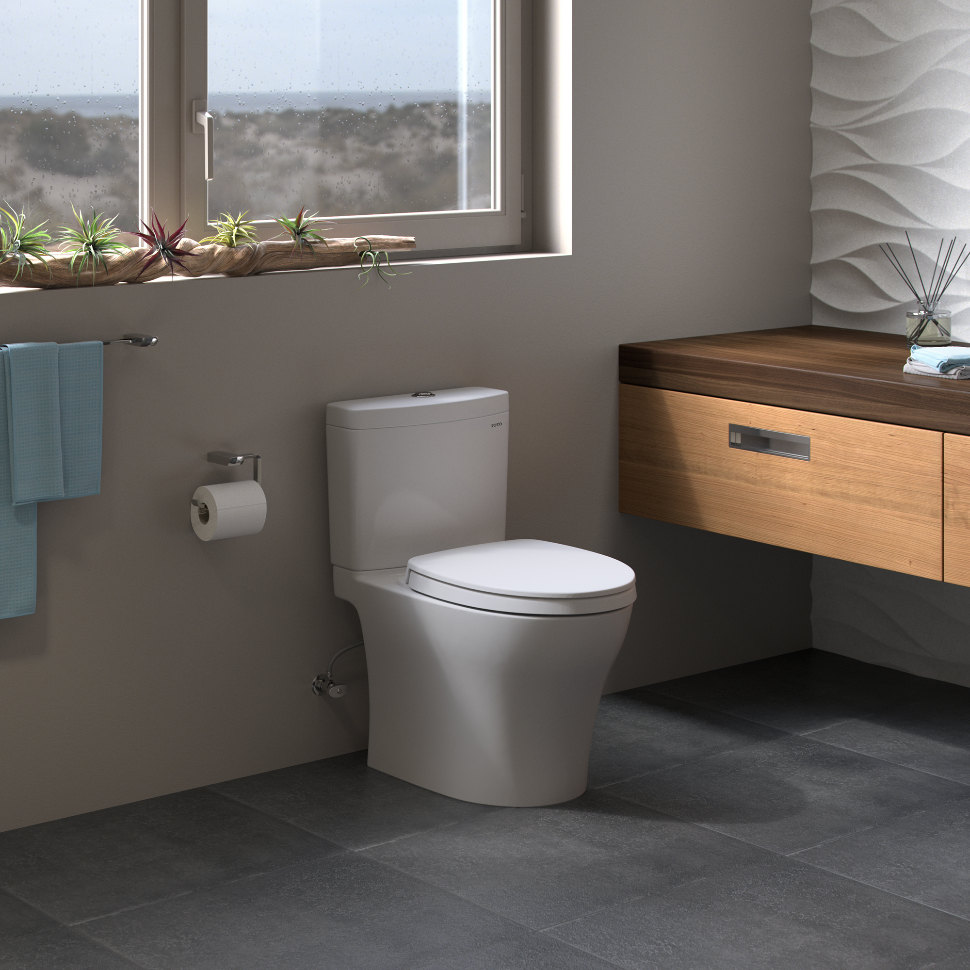 White two-piece elongated toilet with soft-close seat in modern bathroom setting.