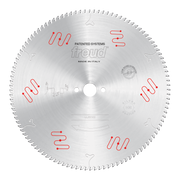 Circular saw blade with multiple teeth around the edge and red patented system markings on silvered aluminum surface.