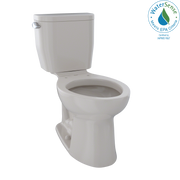 Two-piece elongated toilet in light gray with separate tank and bowl, featuring lever flush handle on the side.
