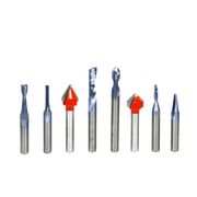Eight CNC router bits with silver shafts and various cutting head styles, including two red pointed bits and six blue spiral 