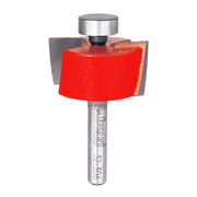 Freud 1-1/4" rabbeting bit with red cutting head, metal shank, and bearing guide, shown with wood sample demonstration.