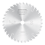 Circular saw blade with conical scoring teeth and central arbor hole, marked Freud, made in Italy.