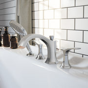 Chrome 4-hole roman tub set with curved spout, two handles, and handheld showerhead on white deck.
