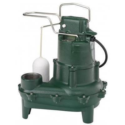 Green cast iron submersible sewage pump with white float switch and metal discharge pipe on base.