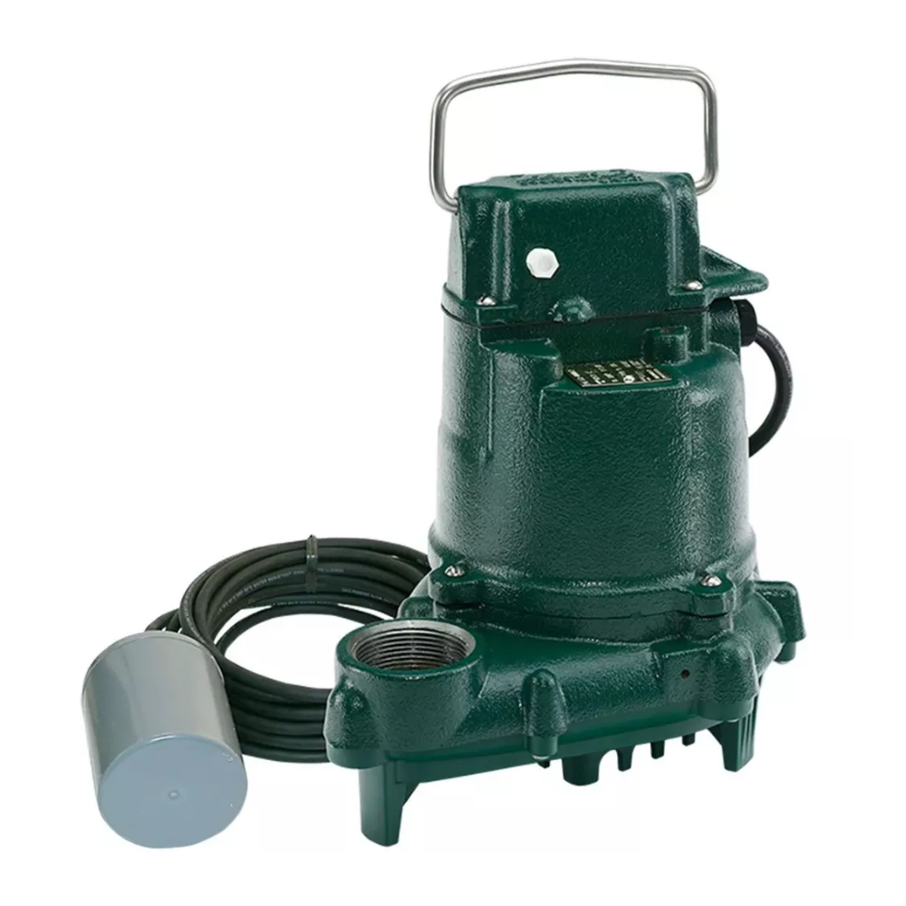 Green cast iron submersible sump pump with handle, coiled black cord, inlet ports, and gray float switch connected by black t